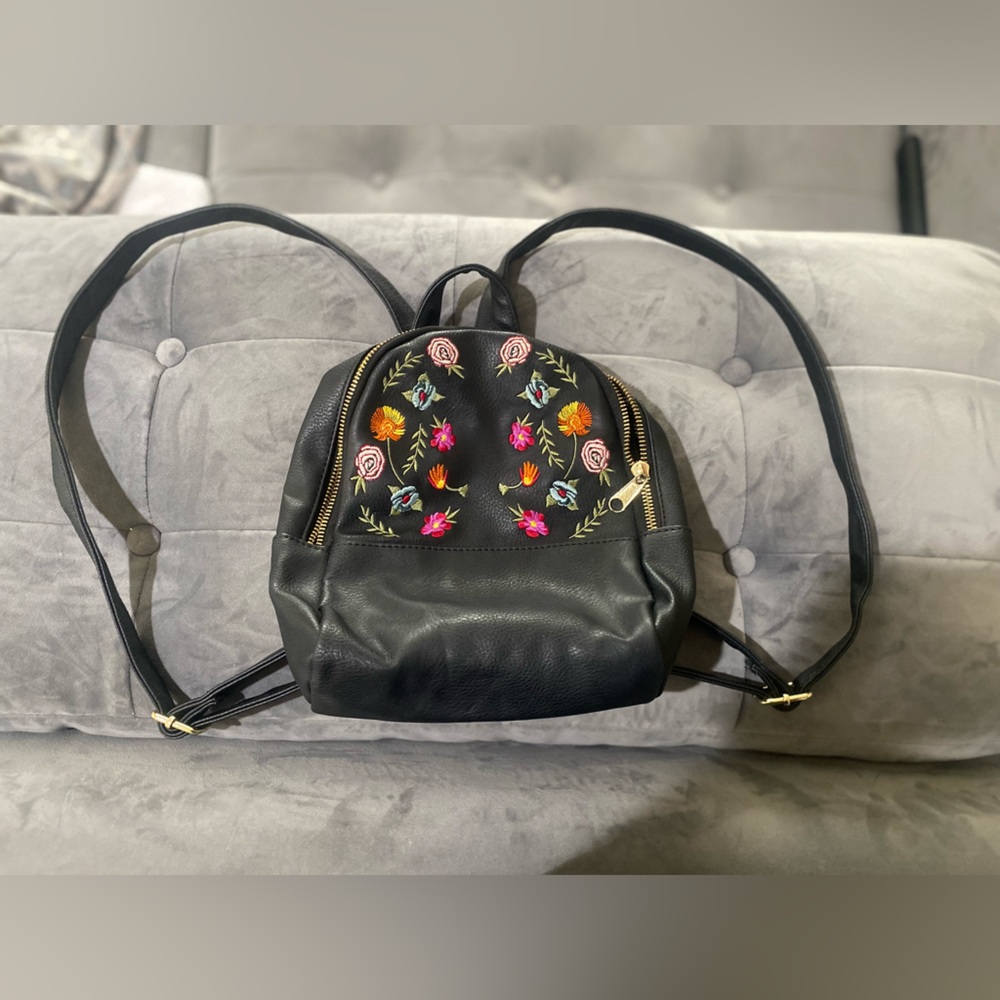 Flower print backpack purse.